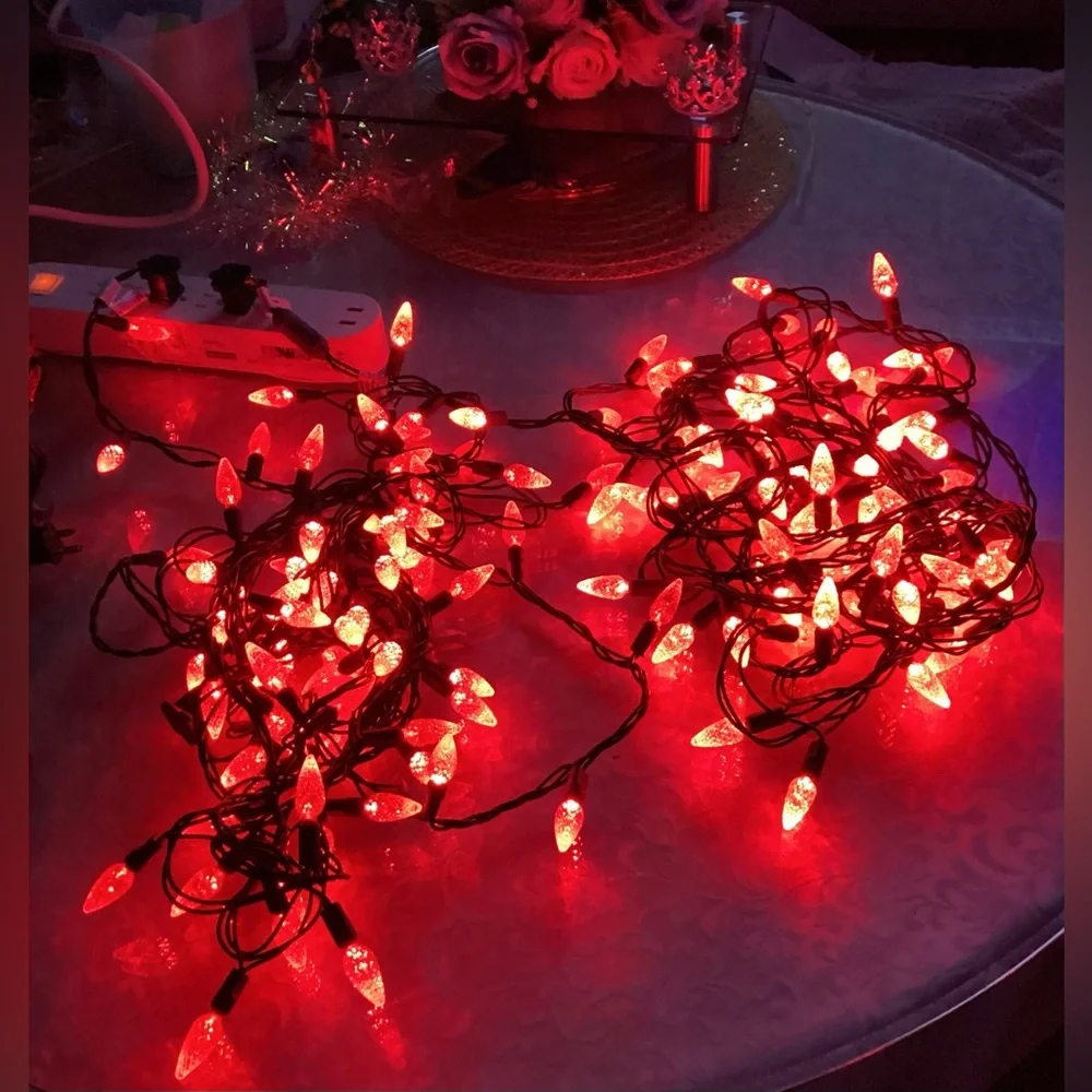 2 Christmas strings red light, bulbs faceted cone shape.